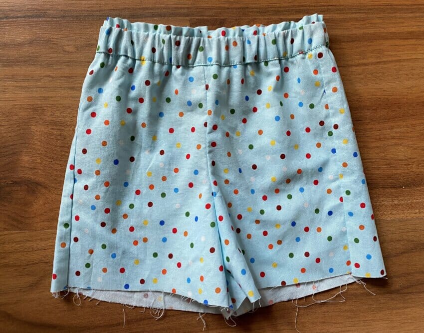 A detail shot of the finished waistband showing the small fabric ruffle at the top, created by sewing a parallel line of stitching above the elastic casing