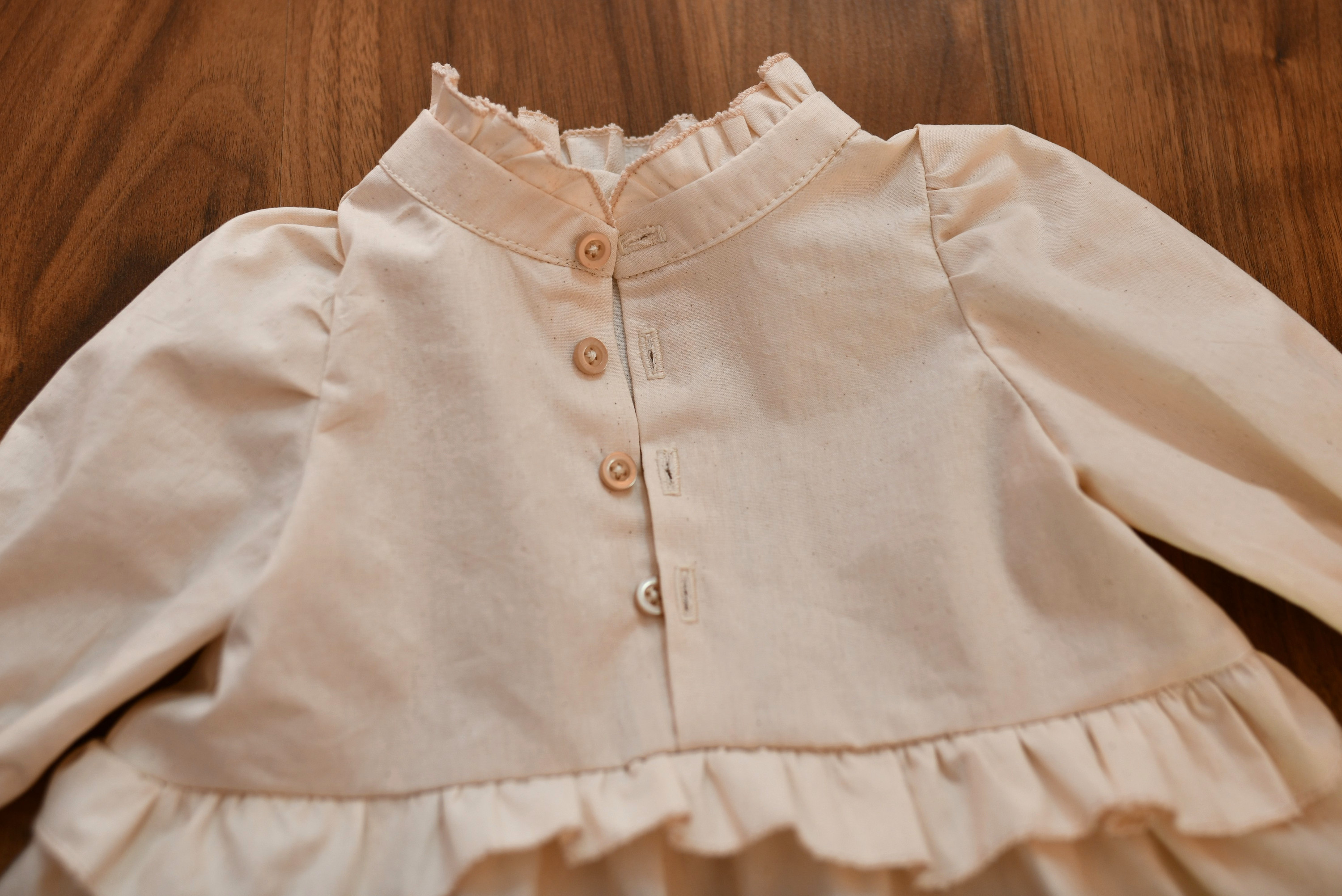 DIY baby dress with buttons and ruffles