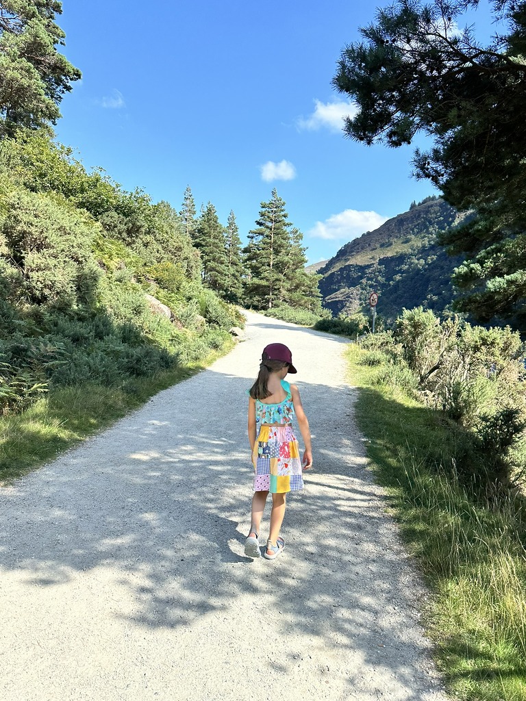 Child wearing handmade patchwork skirt with bright happy prints