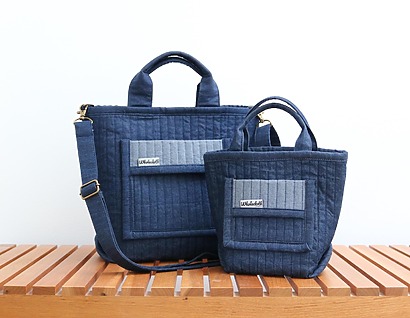 WholeclothPatterns Morris Tote: Two quilted bags in standard and mini sizes, featuring a classic quilt design and binding along the edges and handles