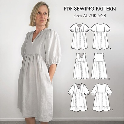 A boho-style Isobel dress in a floral print featuring a gathered midi skirt and elasticated puffed sleeves