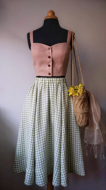 A voluminous six-panel Valletta skirt in a lightweight natural fabric with a drawstring waistband and structured hem