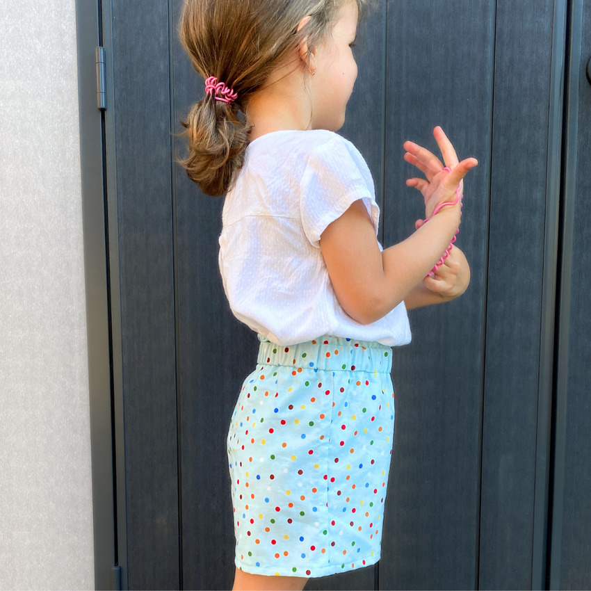 Side profile of the modified city gym shorts showing the clean finish without bias binding and the added length for better coverage