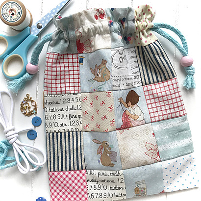 Dottie Drawstring Bag by HelenPhilippsDesigns